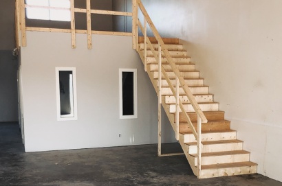 A simple staircase and railing building project for a commercial building project to make code compliant space above the offices.