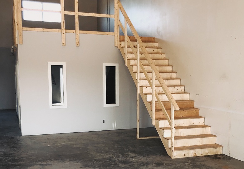 A simple staircase and railing building project for a commercial building project to make code compliant space above the offices.